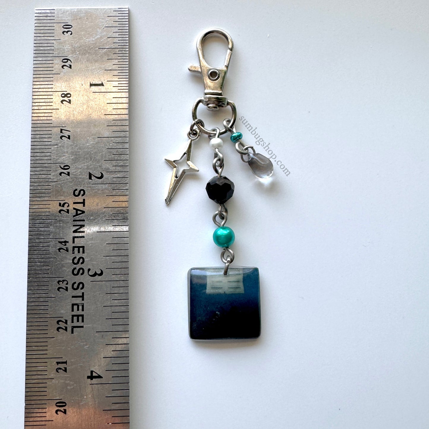 "hit me hard and soft" album keychain