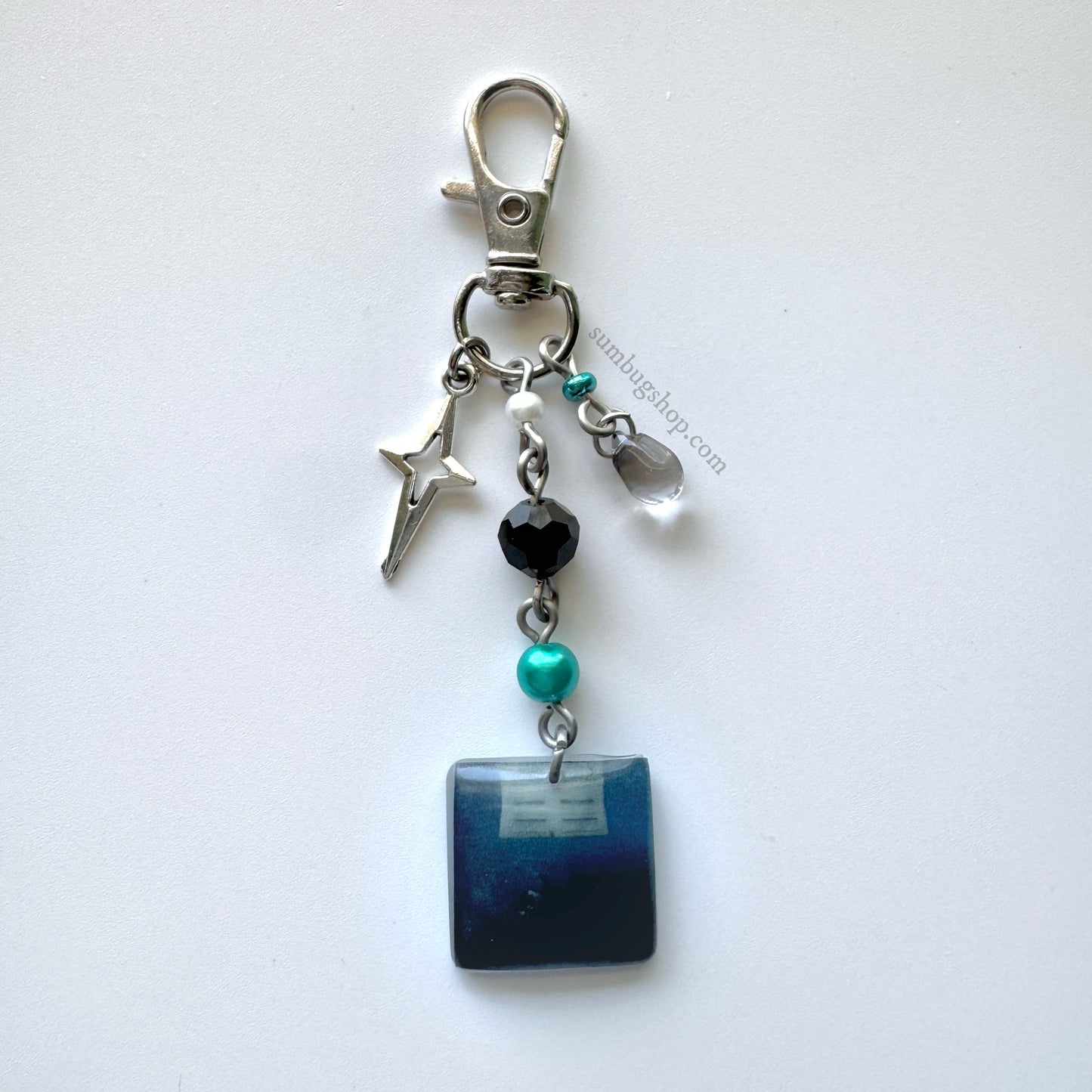 "hit me hard and soft" album keychain